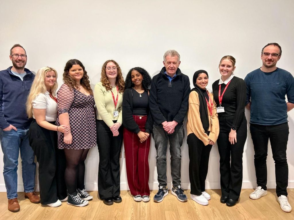 Ed Walker and Luke Beardsworth are at either end of a line of students.